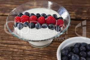 Fruit ice cream and blueberry on wooden table
