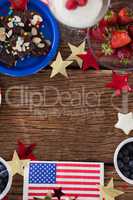 Various sweet foods and fruits arranged on wooden table
