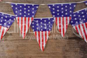 Bunting flags arranged on wooden table