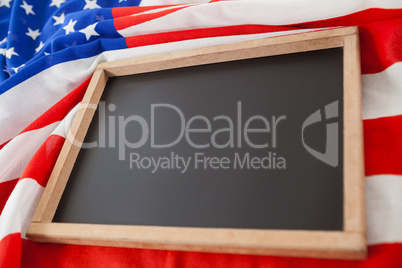 American flag and slate on wooden table