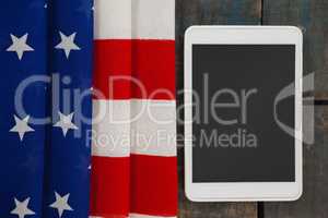 Digital tablet on American flag