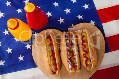 Hot dog on heart shape wooden board with 4th July theme