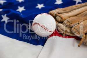 Baseball and gloves on an American flag