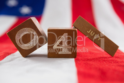 Date blocks on American flag with 4th july theme
