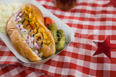 Hot dog served on table cloth