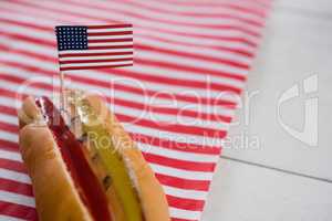 Hot dog on wooden table with 4th july theme