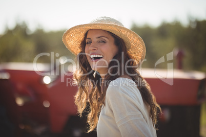 Portrait cheerful young woman wearing sun hat