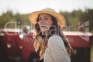 Portrait cheerful young woman wearing sun hat