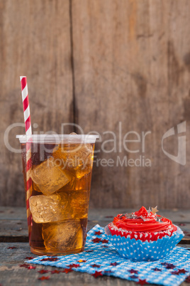 Decorated cupcake and cold drink with 4th july theme