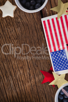 American flag and star shape decoration arranged on wooden table