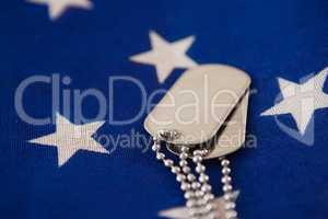 Close-up of dog tag on an American flag