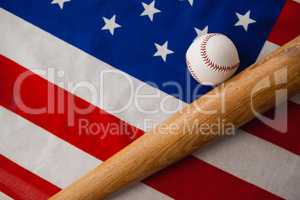 Baseball bat and ball on American flag