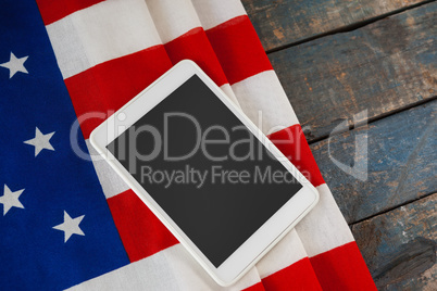 Digital tablet on American flag