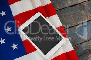 Digital tablet on American flag