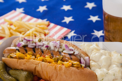 Hot dog and french fries on wooden tale