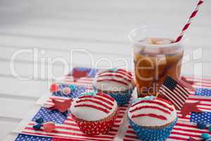 Decorated cupcakes and cold drink with 4th july theme