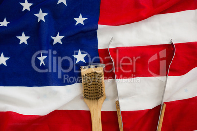 Tong and brush on American flag