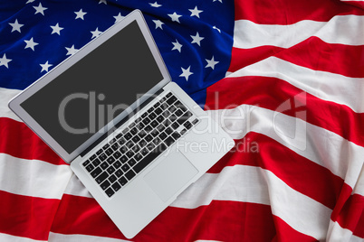 Laptop on American flag with 4th july theme