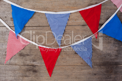 Bunting flags arranged on wooden table