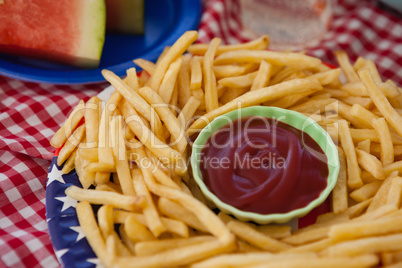French fries with ketchup in plate