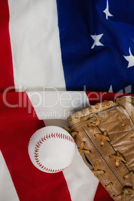 Baseball and gloves on an American flag