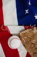 Baseball and gloves on an American flag