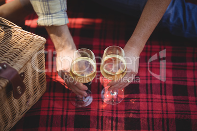 Cropped hands of man and woman holding wineglasses