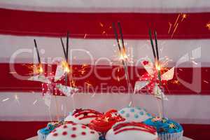 Burning sparkler on decorated cupcakes