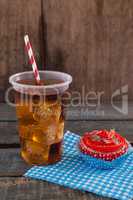 Decorated cupcake and cold drink with 4th july theme