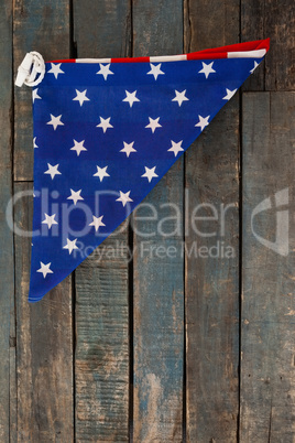 Folded American flag on wooden table