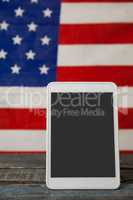 Digital tablet on American flag