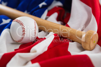 Baseball and baseball bat on an American flag