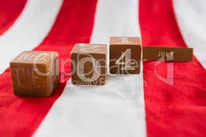 Date blocks on American flag with 4th july theme