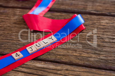 Date blocks arranged on red and blue ribbon