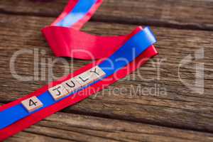 Date blocks arranged on red and blue ribbon