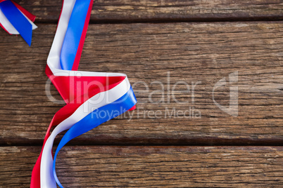 Red, white and blue ribbon arranged on table