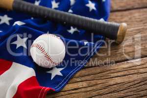 Baseball and bat on an American flag