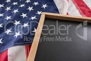 American flag and slate on wooden table