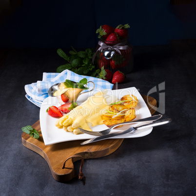 Asparagus , hollandaise sauce and baked potatoes