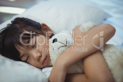 Girl sleeping on the bed in bed room