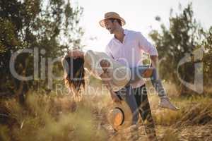 Happy young couple posing at olive farm