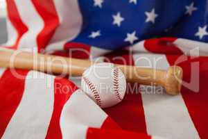 Baseball bat and ball on American flag