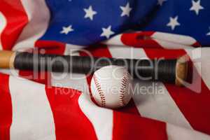 Baseball bat and ball on American flag