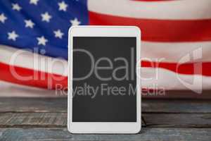 Digital tablet on American flag