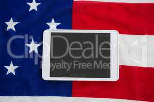 Digital tablet on an American flag