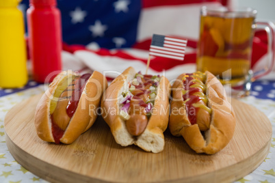 Hot dog served on chopping board