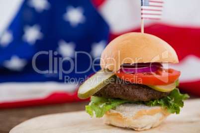 Burger on wooden table with 4th july theme