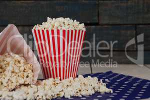 Close-up of scattered popcorn on wooden table