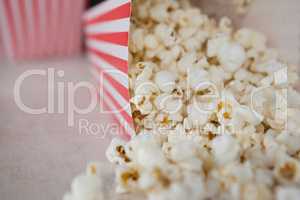 Close-up of scattered popcorn on wooden table