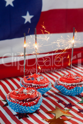 Burning sparkler on decorated cupcakes